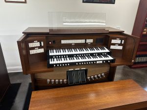 Allen G220i – This organ includes 39 Stops with GENISYS™ Voices, Efficient LED tab stop controls, GENISYS™ Display, Two-Manuals, 32-note AGO pedalboard, Illuminated clear acrylic music rack, pedal light, GENISYS™ Remote, Hymn-Player™, Performance Player™, 10 General and 6 Divisional pistons, Dark-walnut console finish with locking rolltop, Lift-lid bench with storage area, Self-contained and external audio.   Contact Sandrock Music Company for more information and pricing.