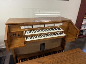 Allen Protégé AP-4 Organ: This Allen Protégé AP-4 is a two-channel self-contained audio instrument featuring the compact LED tab stop control console. The organ comes with 27 speaking stops, clear acrylic music rack, two-manuals of Allen premium keyboards, lift-lid bench with storage area, 32-note AGO pedalboard, dual memory capture system, independent classical and full tremulants, one expression pedal plus GT-PD Unenclosed, digital reverberation and Allen’s MIDI Division II. Optional items available to include is the MIDI Assistant II and two or four external speaker cabinets. Call Sandrock Music for additional information and/or to see, hear and play this wonderful instrument in our showroom! Allen Protégé AP-4 Organ: This Allen Protégé AP-4 is a two-channel self-contained audio instrument featuring the compact LED tab stop control console. The organ comes with 27 speaking stops, clear acrylic music rack, two-manuals of Allen premium keyboards, lift-lid bench with storage area, 32-note AGO pedalboard, dual memory capture system, independent classical and full tremulants, one expression pedal plus GT-PD Unenclosed, digital reverberation and Allen’s MIDI Division II. Optional items available to include is the MIDI Assistant II and two or four external speaker cabinets. Call Sandrock Music for additional information and/or to see, hear and play this wonderful instrument in our showroom!